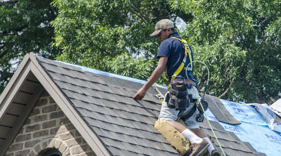 man installing roof